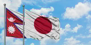 Flags of Nepal and Japan waving Flags of Nepal and Japan waving