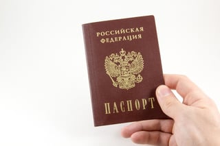 hand-holding-a-russian-federation-passport hand-holding-a-russian-federation-passport