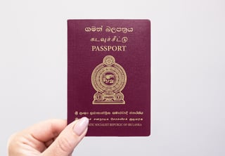 Hand holding a Sri Lankan passport Hand holding a Sri Lankan passport