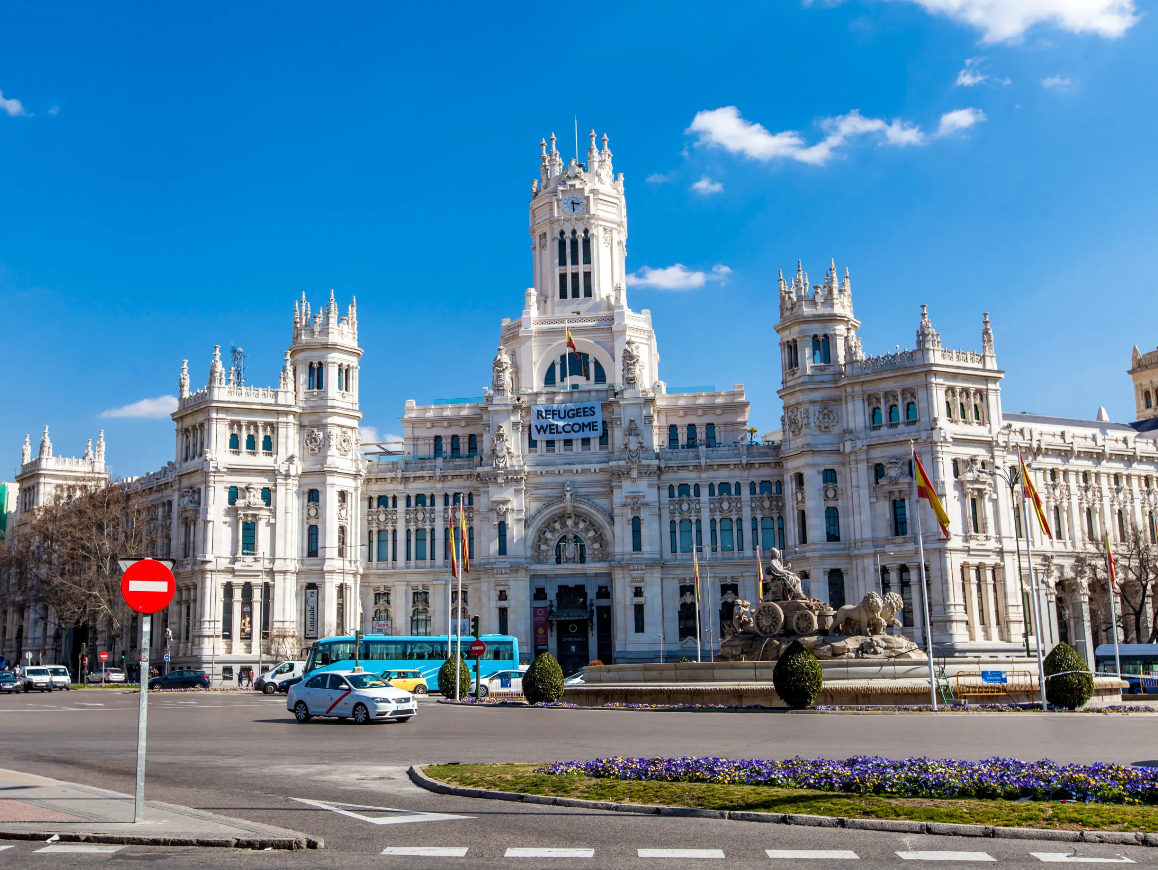 eople on at plaza de cibeles this square with a neo