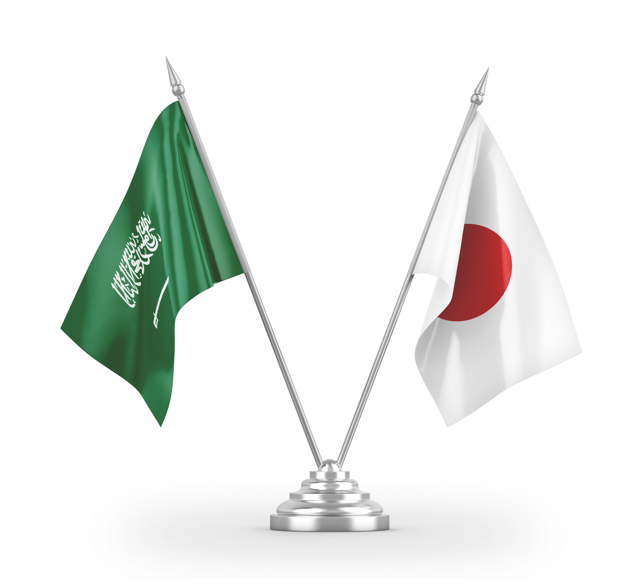 Crossed flags of Saudi Arabia and Japan on a silver stand Crossed flags of Saudi Arabia and Japan on a silver stand