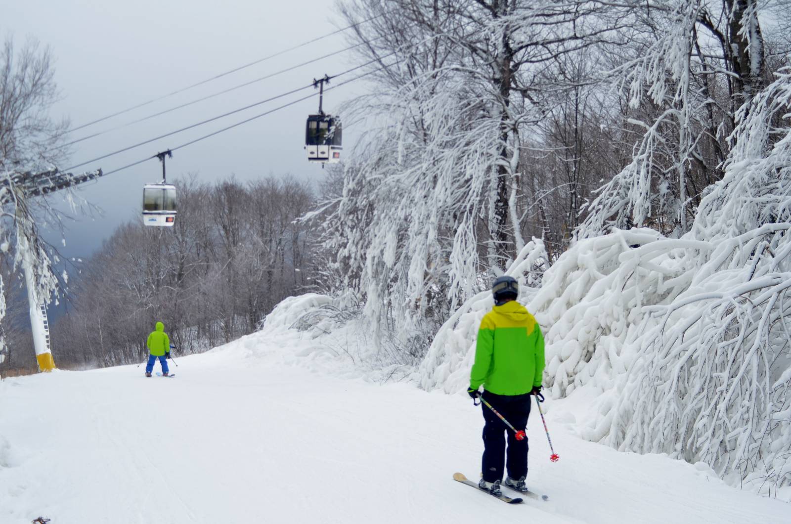 Skiers On A Snowy Mountain Slope