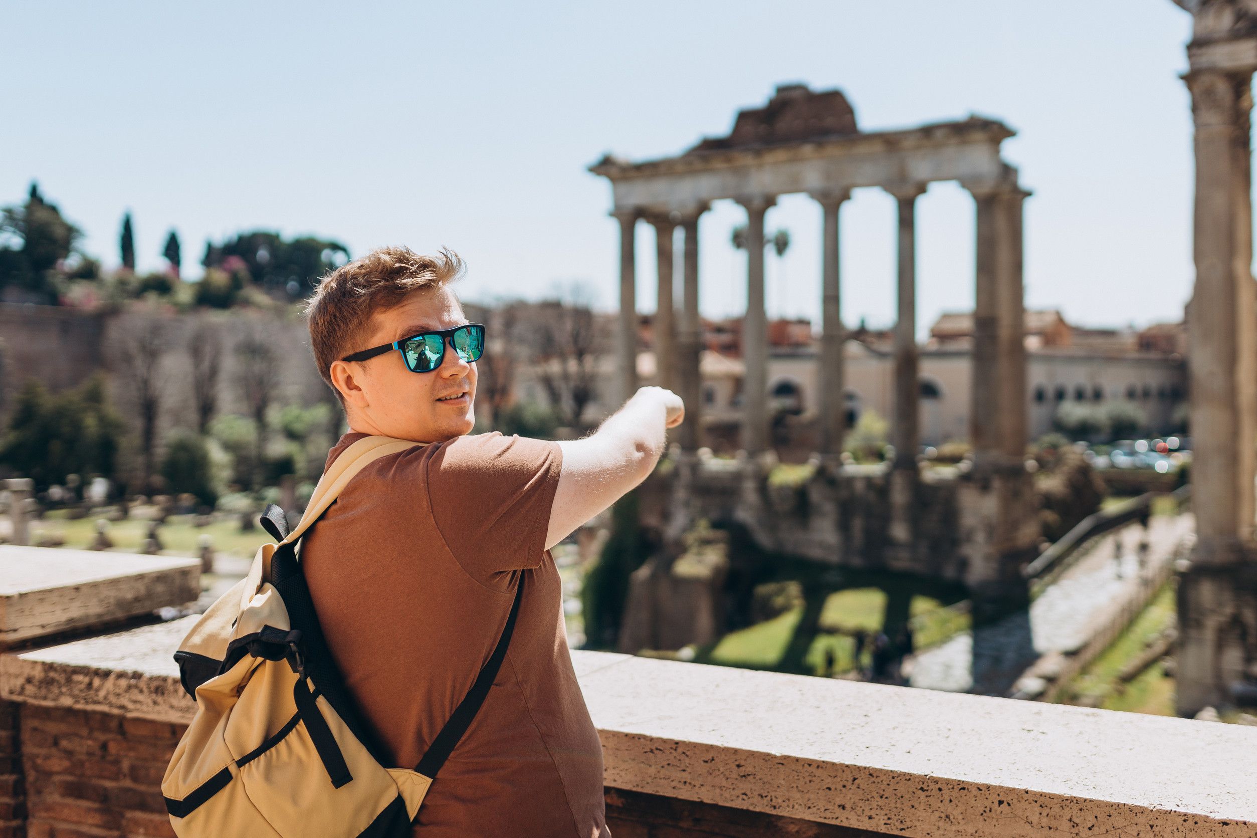 Young Man Tourist In Sunglasses Resting At Roman Forum Historical Imperial Foro Romano From